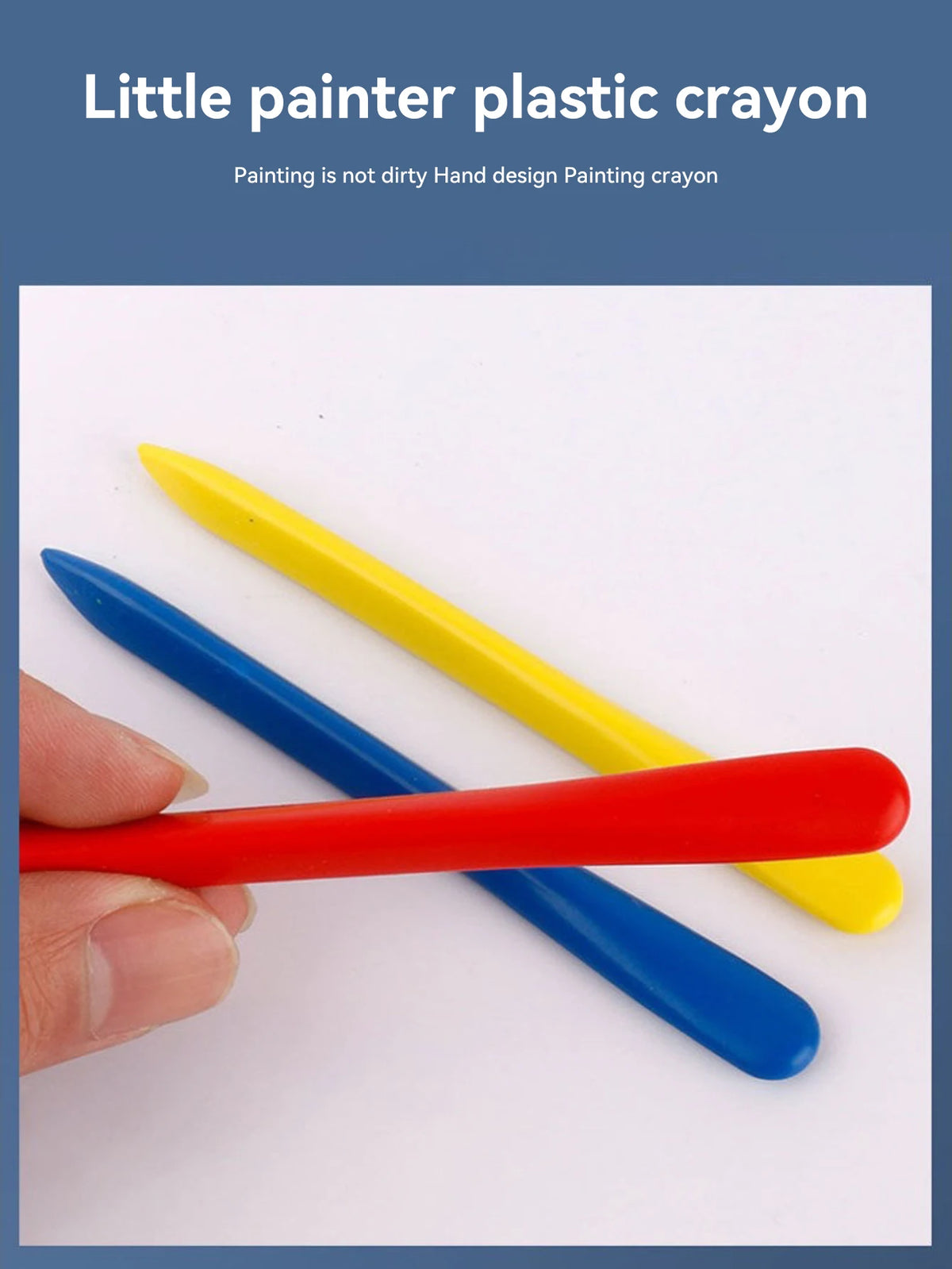 A hand holds several plastic crayons in red, blue, and yellow colors on a white background.