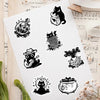 A pack of black cat fantasy stickers on a white background
