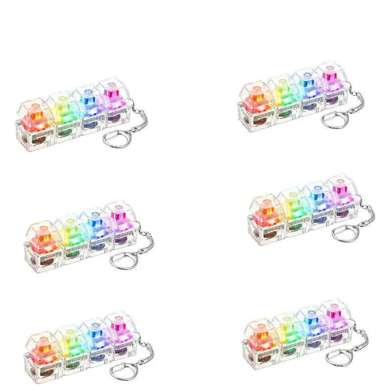 A set of illuminated stress-relief keychain toys featuring colorful keyboard buttons.