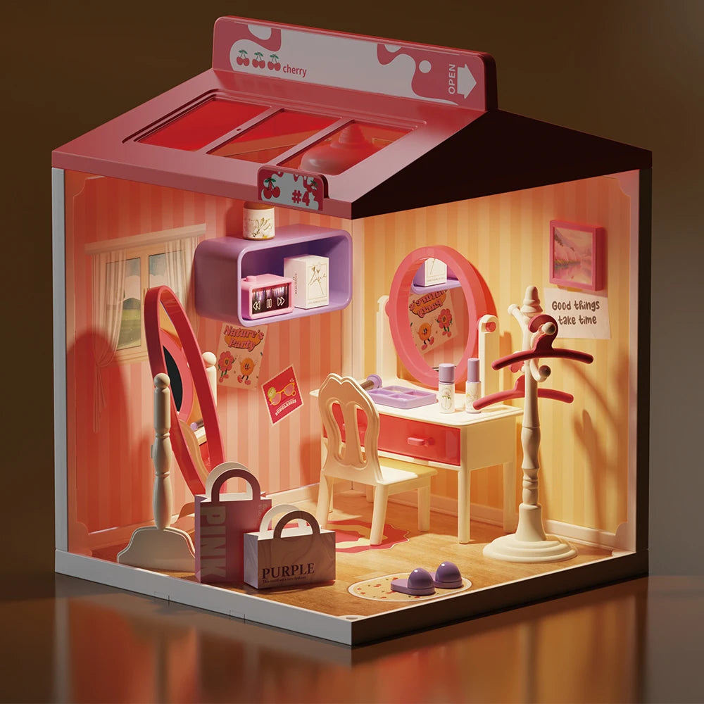 A miniature DIY dollhouse kit featuring pink and white furniture, including a desk, chair, and various accessories.