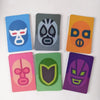 A collection of nine colorful, rectangular strategy game boards featuring stylized animal or abstract faces.
