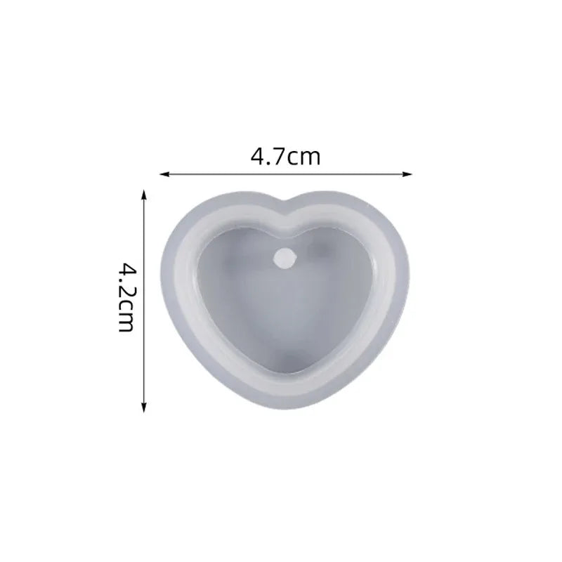 A gray heart-shaped silicone mold used for resin jewelry making.