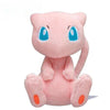 A pink Kawaii anime plush doll with large blue eyes sitting in a cute pose.