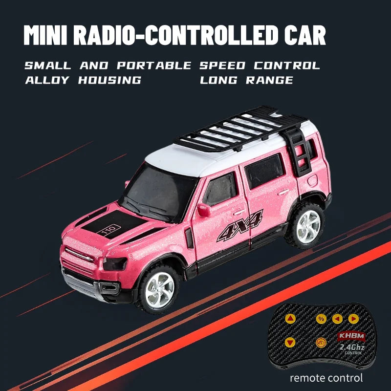 Pink mini radio-controlled car with black accents and 4x4 tires shown against a dark background.