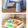 A blue musical baby piano playmat with a light-up keyboard and hanging toys is shown on a wooden floor.