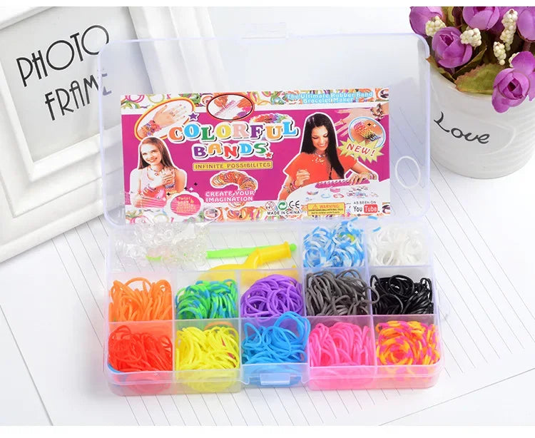 A clear plastic box containing various colored rainbow loom bands for DIY bracelet making.
