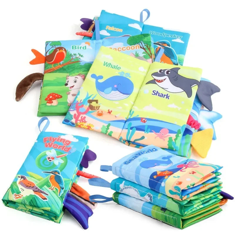 A stack of soft touch and feel baby books with crinkle sounds for infants, featuring sea creatures and animals.