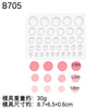A white silicone mold set with various circular shapes and pink colored molds, used for baking and crafts.