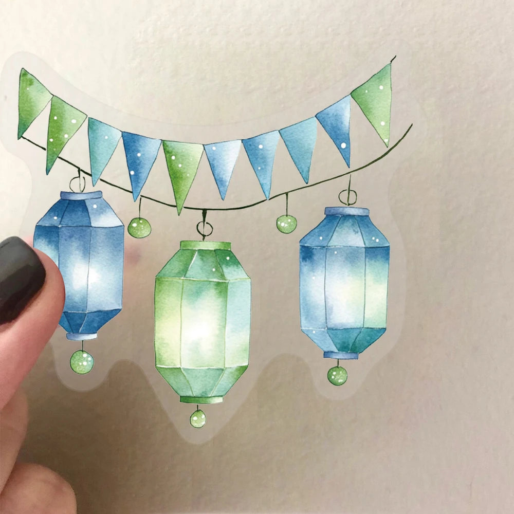 A string of green and blue triangular pennant banners hangs above three glass-shaped lanterns.