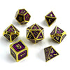 A collection of polyhedral dice in a multicolor gold finish, including dodecahedron and tetrahedron shapes.
