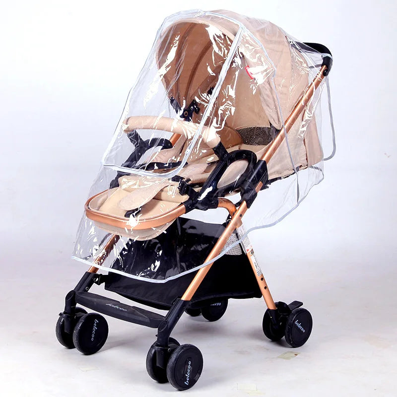 A beige universal stroller rain cover with a clear plastic hood is shown on a black stroller frame.