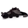 A black and silver rainbow dragon plush pillow with soft fur texture.