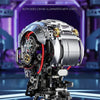 A detailed mechanical skeleton head building kit with intricate gears and components, illuminated by two side lights.