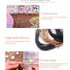 A collection of various metal O-ring spring clasps and jewelry components displayed on a wooden surface.