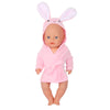 A baby doll wearing a pink cartoon animal bathrobe and nightgown set.