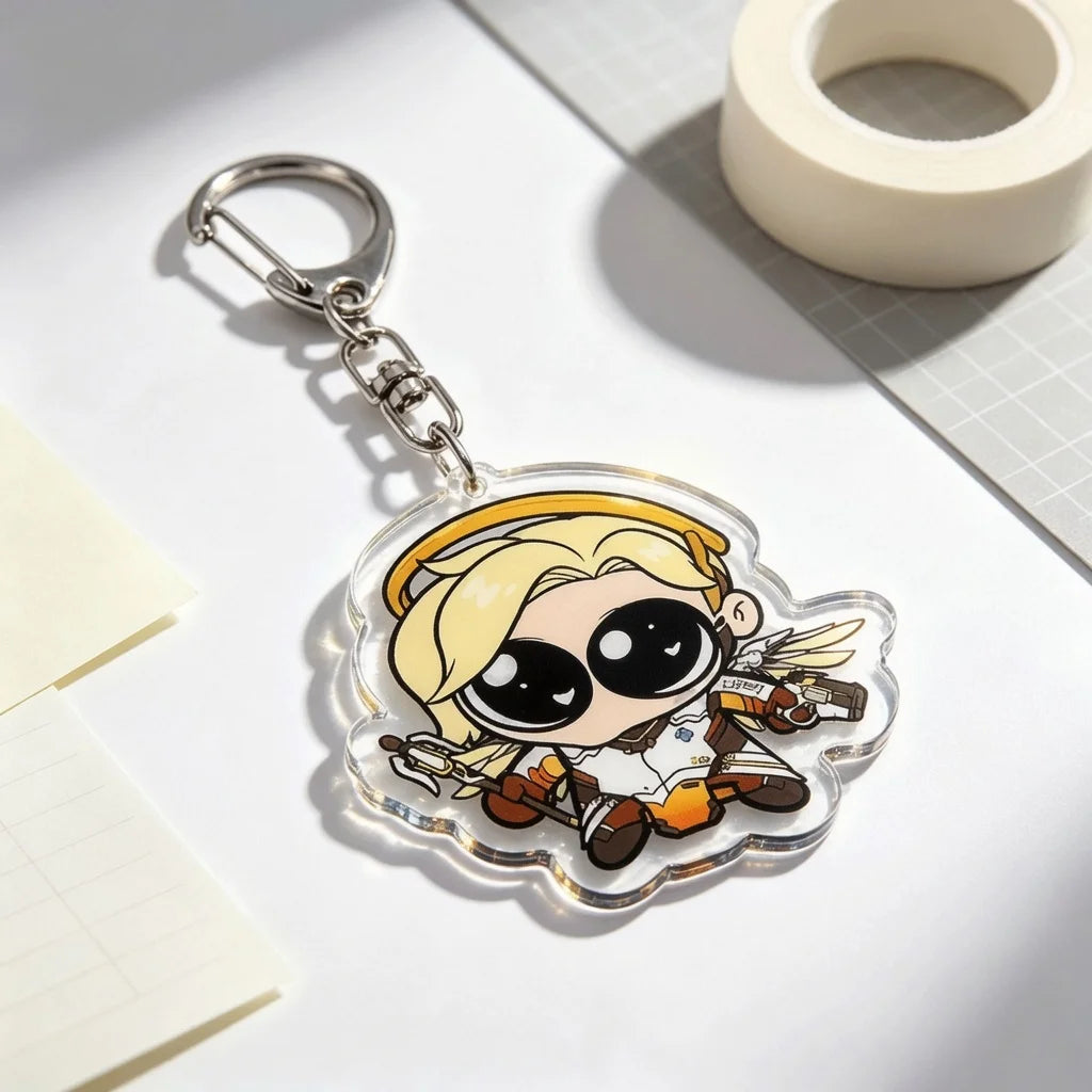 A clear acrylic keychain charm featuring an anime-style character with blonde hair and wings.
