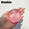 A hand holds a pink, translucent Vaseline fidget ball for stress relief.