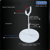 A clear acrylic doll display stand with a metal rod and a transparent base.