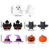 A collection of Halloween silicone beads including white ghost, black bat, and orange pumpkin shapes for jewelry making