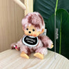A fluffy pink cartoon plush toy resembling a small animal is displayed next to a measuring stick.