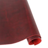 A roll of deep burgundy Crazy Horse leather used for DIY crafting and leatherwork.