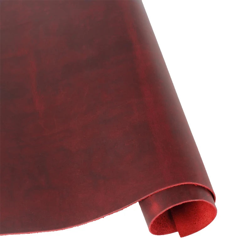 A roll of deep burgundy Crazy Horse leather used for DIY crafting and leatherwork.