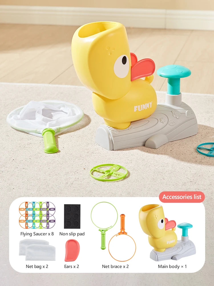A yellow duck-shaped foot launcher toy with an attached flying disc and catching nets and accessories.