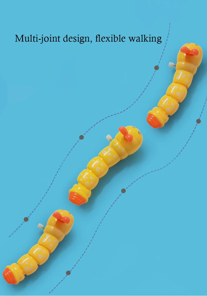 A yellow and orange multi-jointed caterpillar crawling toy demonstrating flexible walking.