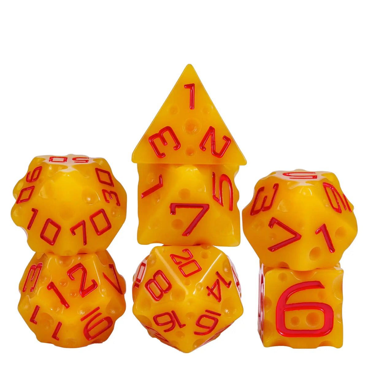 A set of seven yellow dice with red numbers, shaped like cheese, arranged in various orientations.