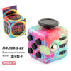 A colorful fidget cube with a rotating joystick and magnetic buttons is shown next to its packaging.