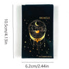 A rectangular black box containing a 54-card oracle deck featuring a crescent moon and stars.