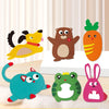 A collection of felt animal figures including a yellow bird, a brown bear, a carrot, a blue cat, a green frog, and a pink rab