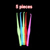 Five glow-in-the-dark loom band bracelet making pieces displayed against a black background.