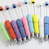 A collection of colorful rhinestone pen blanks for DIY jewelry making, featuring various shades of pink, purple, green, and y