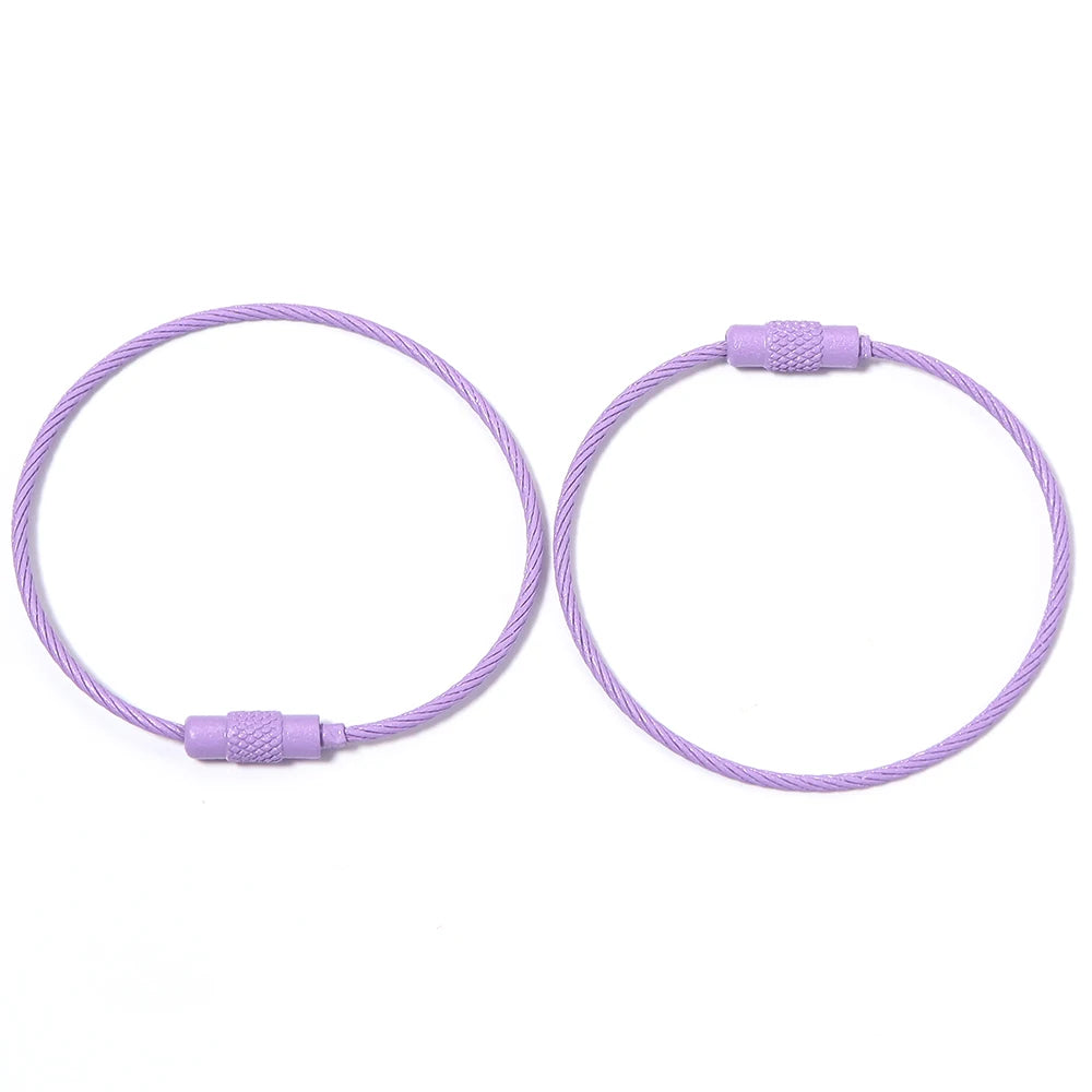 A pair of purple stainless steel wire keychain rings with screw locks.
