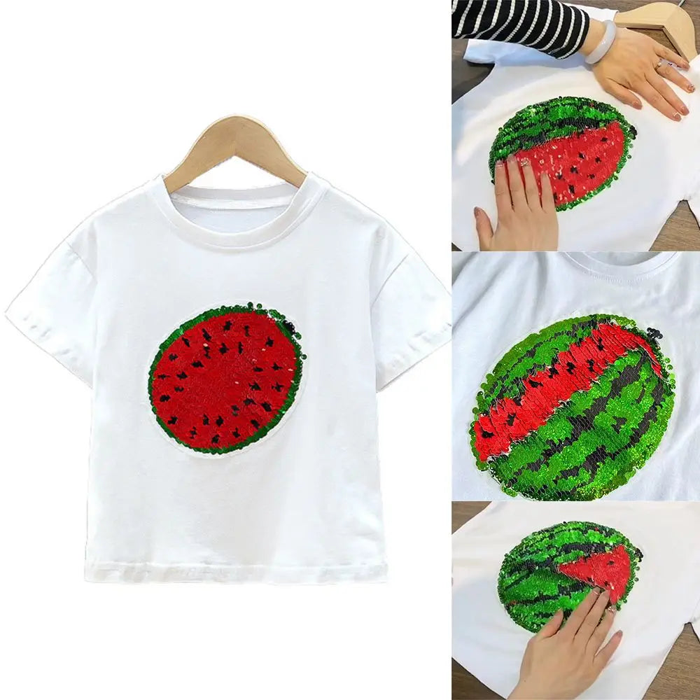 White t-shirt featuring a red and green sequin watermelon design on the chest.