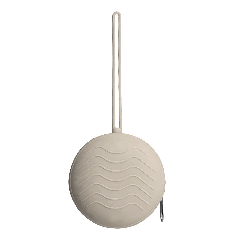 A light beige silicone pacifier holder with a long tube and a round, ribbed case.