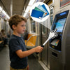 A boy uses a finger to tap a card on a machine for payment.