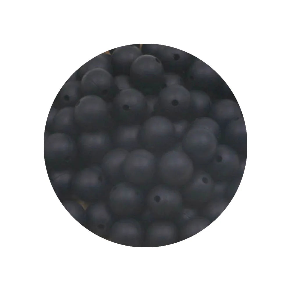 A circular view of small, dark silicone beads of various sizes.