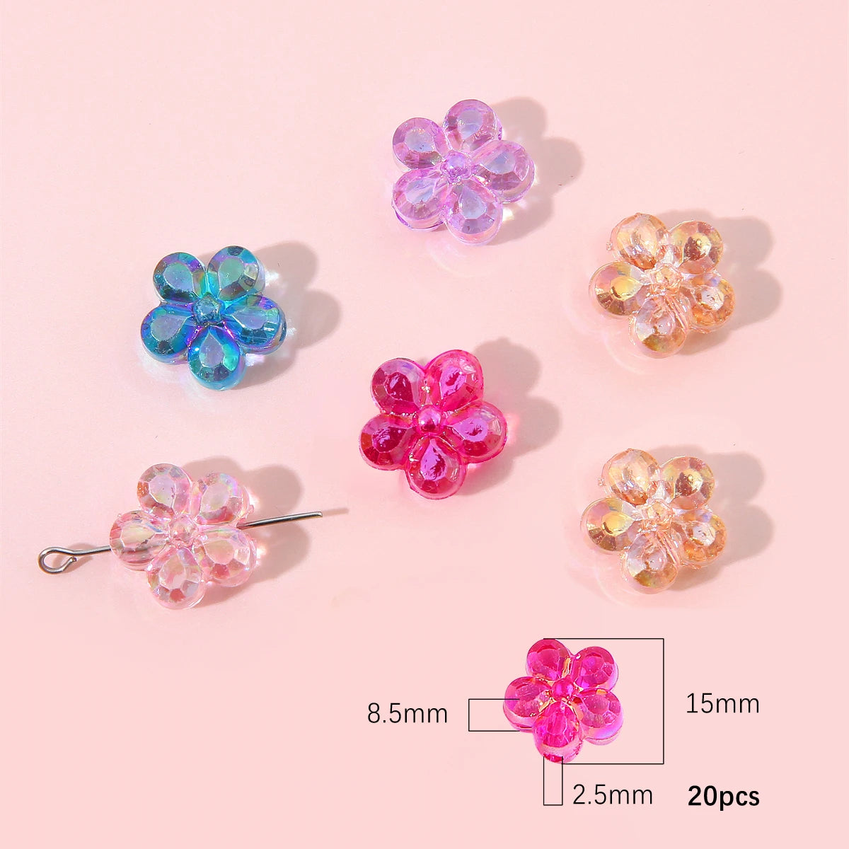 A collection of 20 pink and purple acrylic flower beads shown on a light background with a scale.