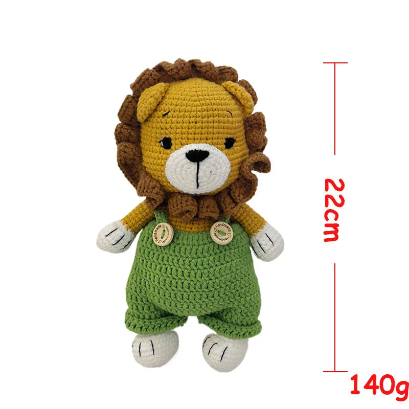 Handmade crochet stuffed bear toy with a golden mane and green body, shown against a white background.