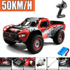 Red and black high-speed 4WD brushless RC monster truck with large tires and a remote control visible.