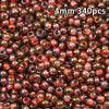 A close-up view of 340 golden gradient glass beads in various shades of amber and reddish-brown.