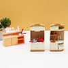 A dollhouse furniture playset featuring a mini kitchen with appliances and a living room setup.