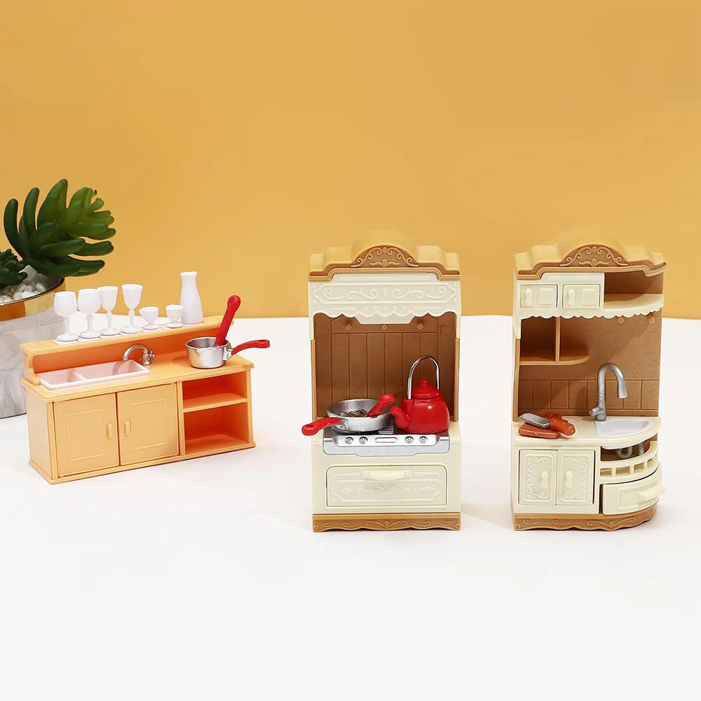 A dollhouse furniture playset featuring a mini kitchen with appliances and a living room setup.