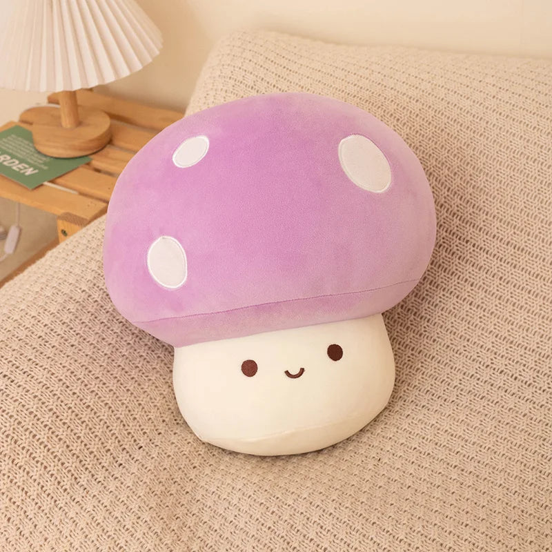 A purple mushroom plush pillow with white spots and a round white body resting on a beige fabric.