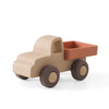 A beige silicone toy truck with an orange cargo bed and round wheels.