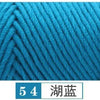Close-up of bright cyan blue yarn showing a twisted, knitted texture.
