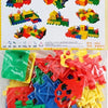A pile of colorful plastic building blocks in various shapes and colors including red, yellow, green, and blue.