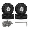 Four black 1.3 inch aluminum RC crawler tires and a metal rod are shown for off-road rigs.